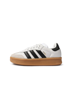 White Adidas Big Kids Samba XLG gradeschool footwear with classic design, featuring white leather and rubber sole.