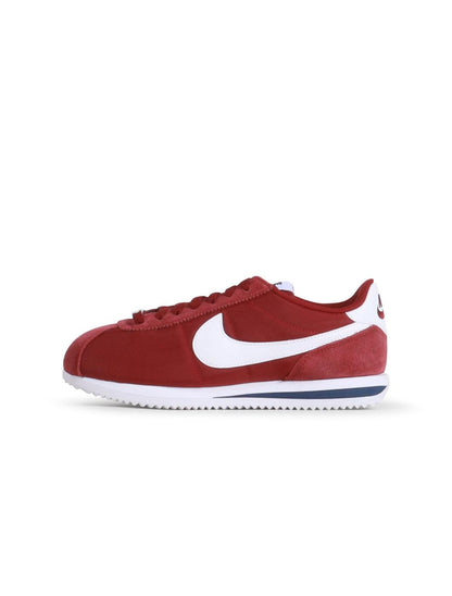 Nike Womens Cortez footwear in Team Red, featuring classic design and athletic style, shown in a side view.