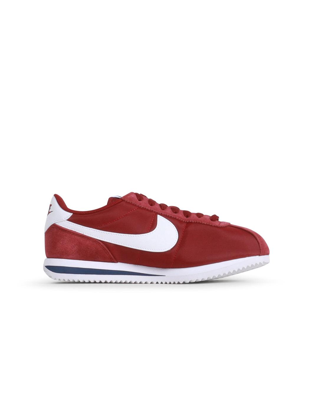 Nike women's Cortez sneakers in Team Red, showcasing classic athletic footwear with white midsole and red laces.