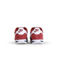 Nike Womens Cortez sneakers in Team Red, stylish women's footwear with classic design and white accents, on a plain background.