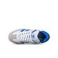 Gradeschool Adidas Samba XLG sneakers in white and royal with leather and synthetic upper, featuring classic sporty design.