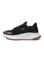 Black Hugo Boss TTNM EVO men's shoes, stylish and sleek footwear with a modern design, displayed on a clean background.