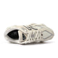 White and grey New Balance 9060 men's lifestyle shoes, showcasing stylish footwear with a modern design and comfortable fit.
