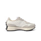 White and black New Balance Women's 327 shoes with stylish design, perfect for casual wear and athletic activities.