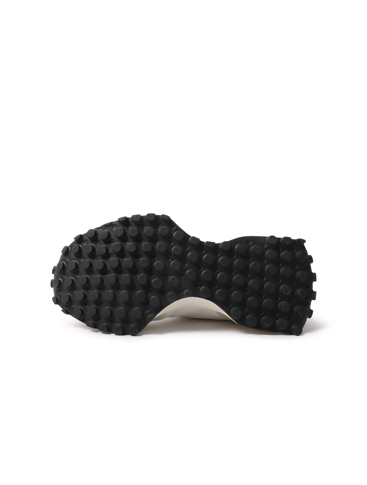 White and black New Balance Women's 327 shoes, stylish footwear with a sleek design, shown in a close-up image.