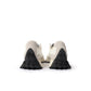 White and black New Balance Women's 327 shoes, stylish sneakers with classic design, displayed on a plain background.