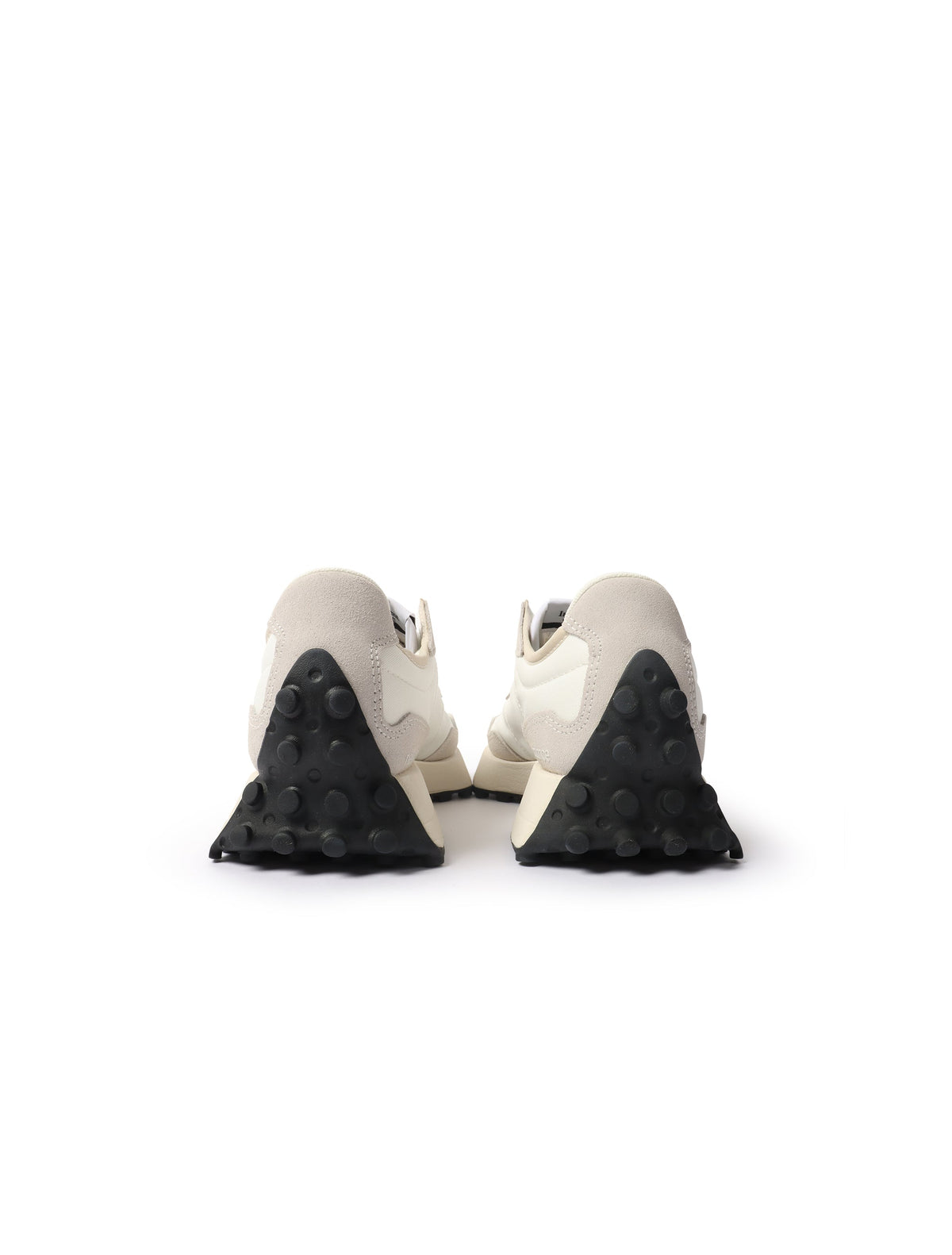 White and black New Balance Women's 327 shoes, stylish sneakers with classic design, displayed on a plain background.