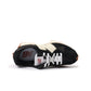 New Balance women's 327 sneakers in black and white with retro-inspired design and textured sole