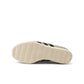 Grey Adidas women's Japan shoes with white accents, showcased on a plain background, highlighting the stylish women's footwear.