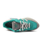 Green Adidas men's Retropy F2 sneakers with white accents, showcasing sporty footwear design for casual and athletic wear.