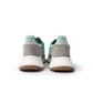 Adidas Men's Retropy F2 green sneakers, stylish men's footwear with athletic design, shown in a natural outdoor setting.