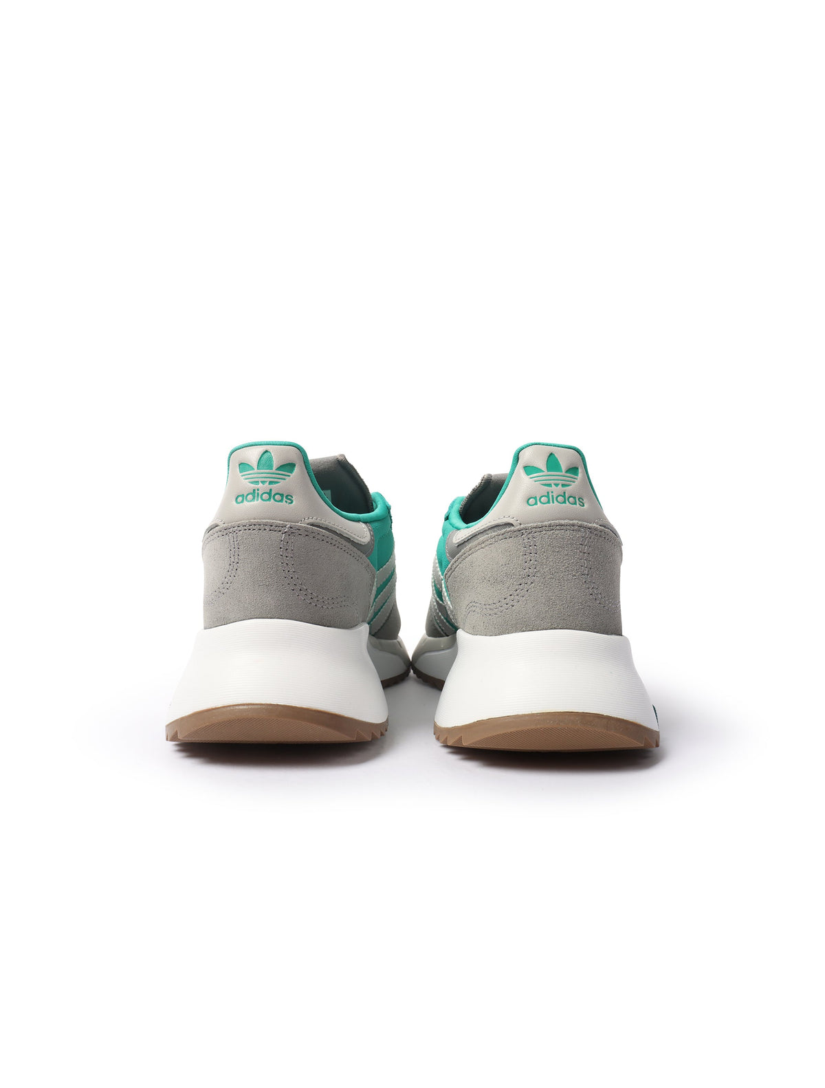 Adidas Men's Retropy F2 green sneakers, stylish men's footwear with athletic design, shown in a natural outdoor setting.