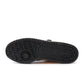 Men's Adidas Forum Low sneakers in black and yellow, showcasing the stylish design and branding on the footwear.