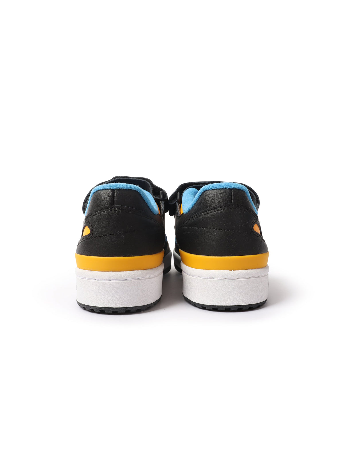 Black and yellow Adidas Forum Low men's footwear with classic design, featuring black leather and yellow accents.