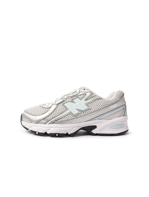 New Balance Women's 740 athletic shoes in grey and light blue, featuring breathable mesh and supportive soles.