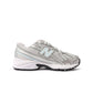 Gray and light blue New Balance Women's 740 athletic shoes on a white background.