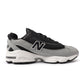 Black and grey New Balance men's 1000N shoes showcasing sporty design and sleek athletic footwear style.