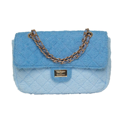 BEACH HAUS Small Shoreline Flap in two-tone blue, compact flap bag shown against a plain background
