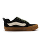 Vans men's Knu School sneakers in black and green with a pop of color, showcasing the stylish footwear design.