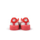 White and red Puma Womens Carina 3.0 Care Bear SS sneakers featuring a casual design, displayed on a clean background.