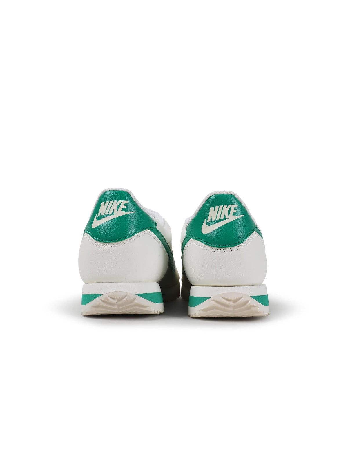 Nike Mens Cortez stadium green sneakers, athletic footwear with white midsole and green Nike logo, casual style for men.