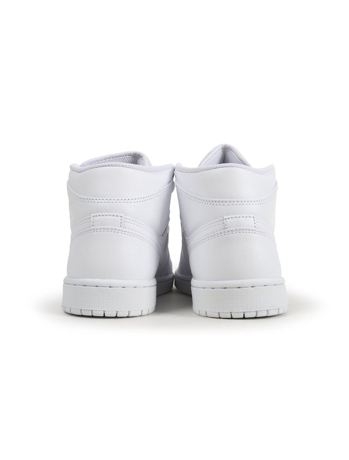 Men's Air Jordan 1 Mid Triple White sneakers by Denim Exchange, side view