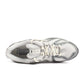 New Balance men's 1906 sneakers in white and grey, showcasing stylish casual footwear with white and grey color accents.