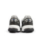 White and grey New Balance men's 1906 sneakers with breathable mesh and supportive soles, shown on a clean background.