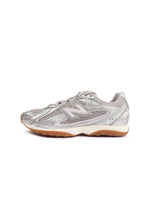 New Balance women's 204L footwear in Truffle Salt, side view of low-top sneaker with textured panels and rubber sole