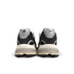 Black New Balance Mens Abzorb 2010 footwear with cushioned sole and sleek design, showcased on a plain background.