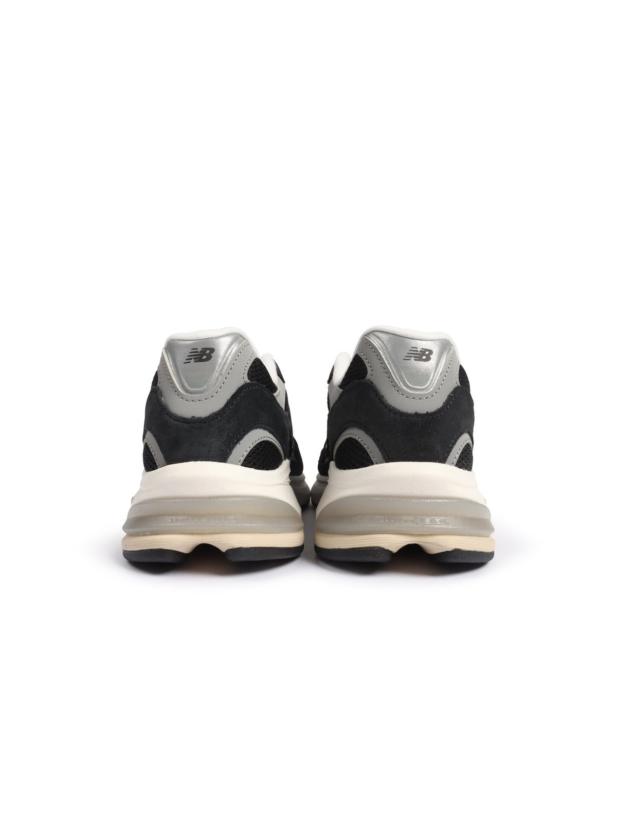 Black New Balance Mens Abzorb 2010 footwear with cushioned sole and sleek design, showcased on a plain background.