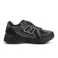 New Balance men's 1906 black hot tomato athletic shoes with mesh and suede details, showcasing sporty men's footwear.