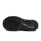 Black New Balance men's 1906 sneakers with hot tomato accents, showcasing stylish footwear designed for comfort and performance.