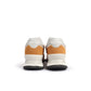 Brown and white New Balance men's 574 sneakers featuring classic athletic style, shown on clean white background.