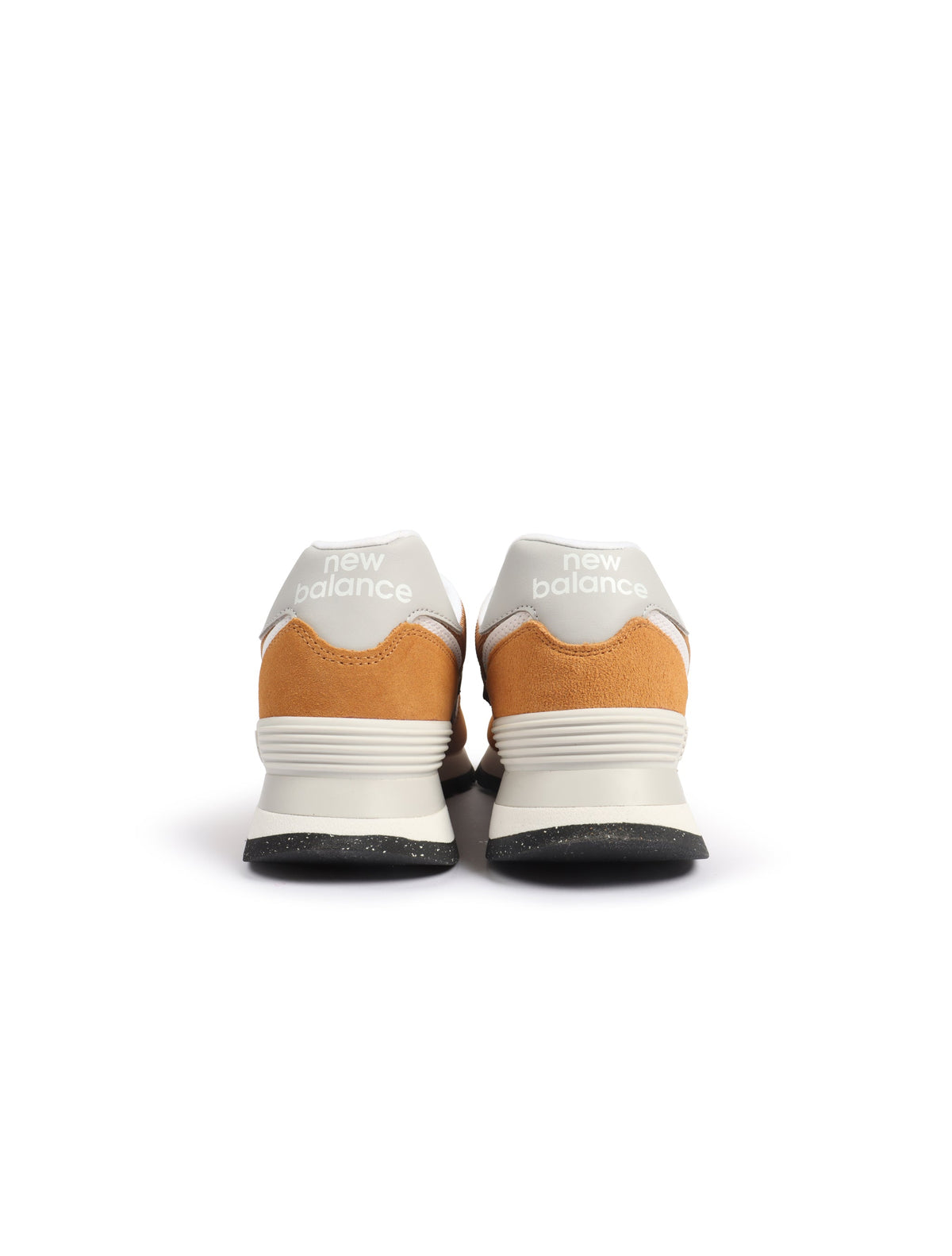 Brown and white New Balance men's 574 sneakers featuring classic athletic style, shown on clean white background.