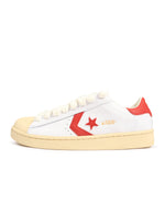 White Converse x Le Fleur men's Pro Leather OX sneakers with Molten Lava accents, casual footwear with stylish design.
