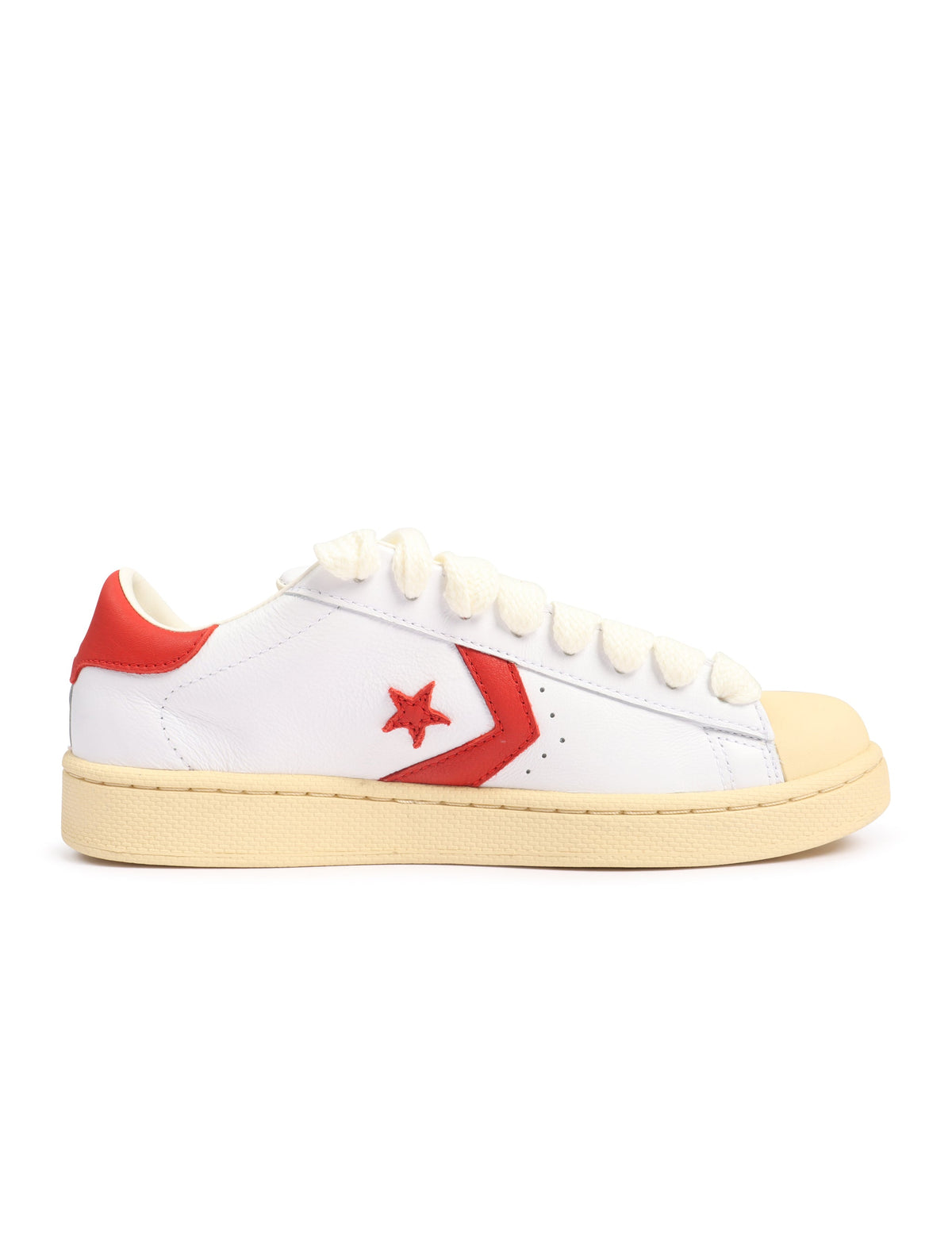 White Converse x Le Fleur men's Pro Leather OX sneakers with molten lava accents, casual footwear, classic canvas design.