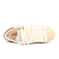 White Converse x Le Fleur men's Pro Leather OX sneakers with molten lava accents, casual footwear with stylish leather details.