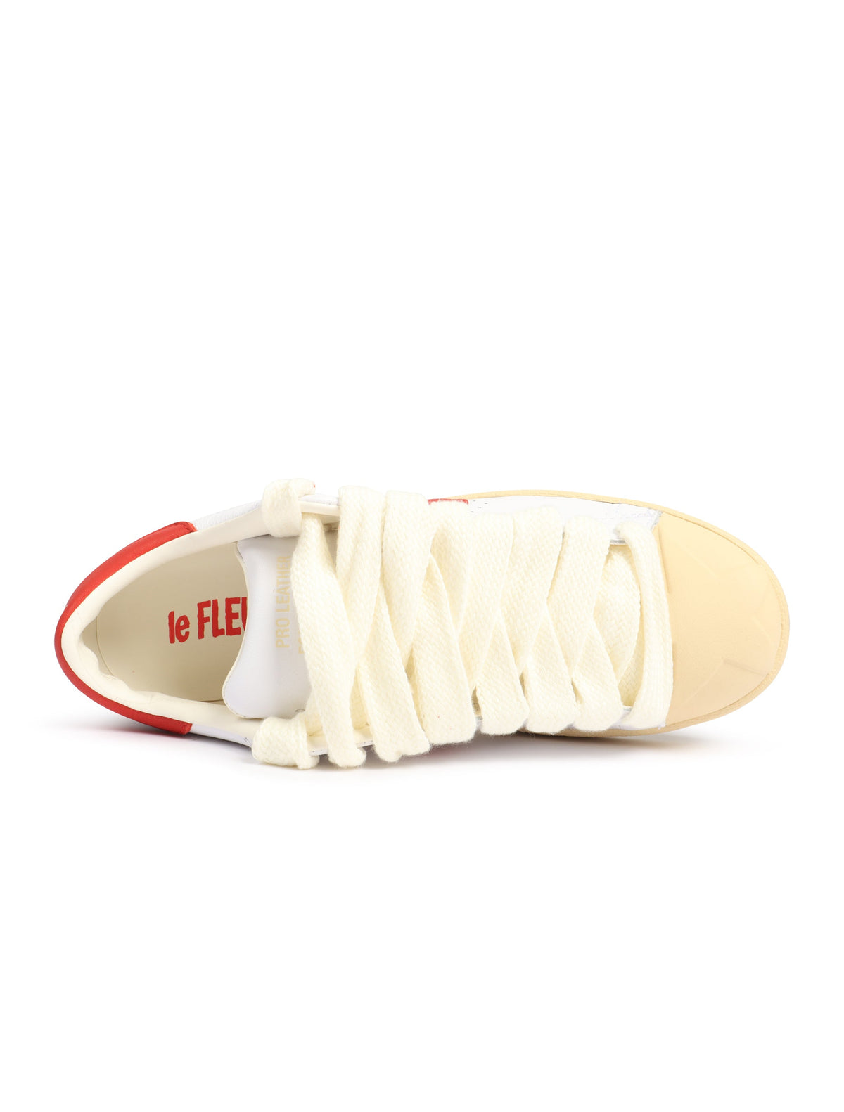 White Converse x Le Fleur men's Pro Leather OX sneakers with molten lava accents, casual footwear with stylish leather details.