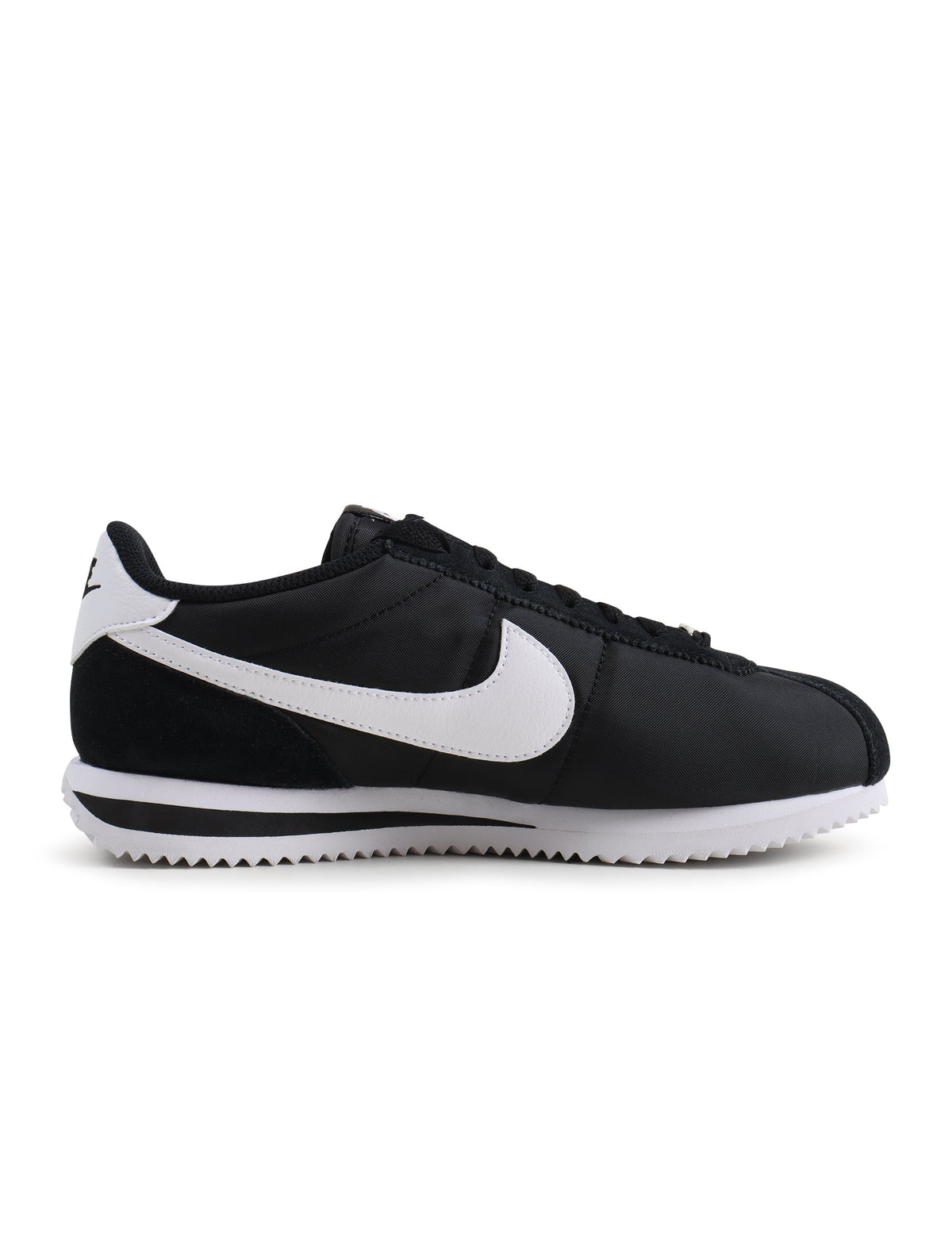 Black and white Nike men's Cortez TXT sneakers by Denim Exchange, side view