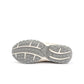 Beige New Balance women's 204L footwear with stylish design, displayed on a neutral background.