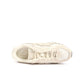 Beige New Balance 204L women's footwear with stylish design, featuring comfortable sneakers suitable for casual wear.