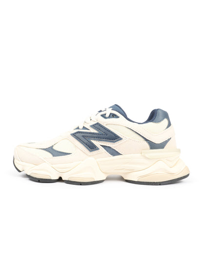 New Balance men's 9060 lifestyle shoes in cream and navy with stylish design and comfortable sneakers for everyday wear.