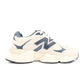 New Balance men's 9060 lifestyle shoes in cream and navy, featuring stylish design and comfortable footwear for everyday wear.