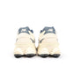 New Balance men's 9060 lifestyle shoes in cream and navy with white accents, showcasing stylish and comfortable footwear.