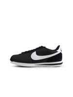 Nike Women's Cortez sneakers in black and white, stylish athletic footwear with classic design and white laces.