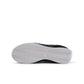 Nike women's Cortez sneakers in black and white, showcasing classic athletic footwear style with white laces and logo details.