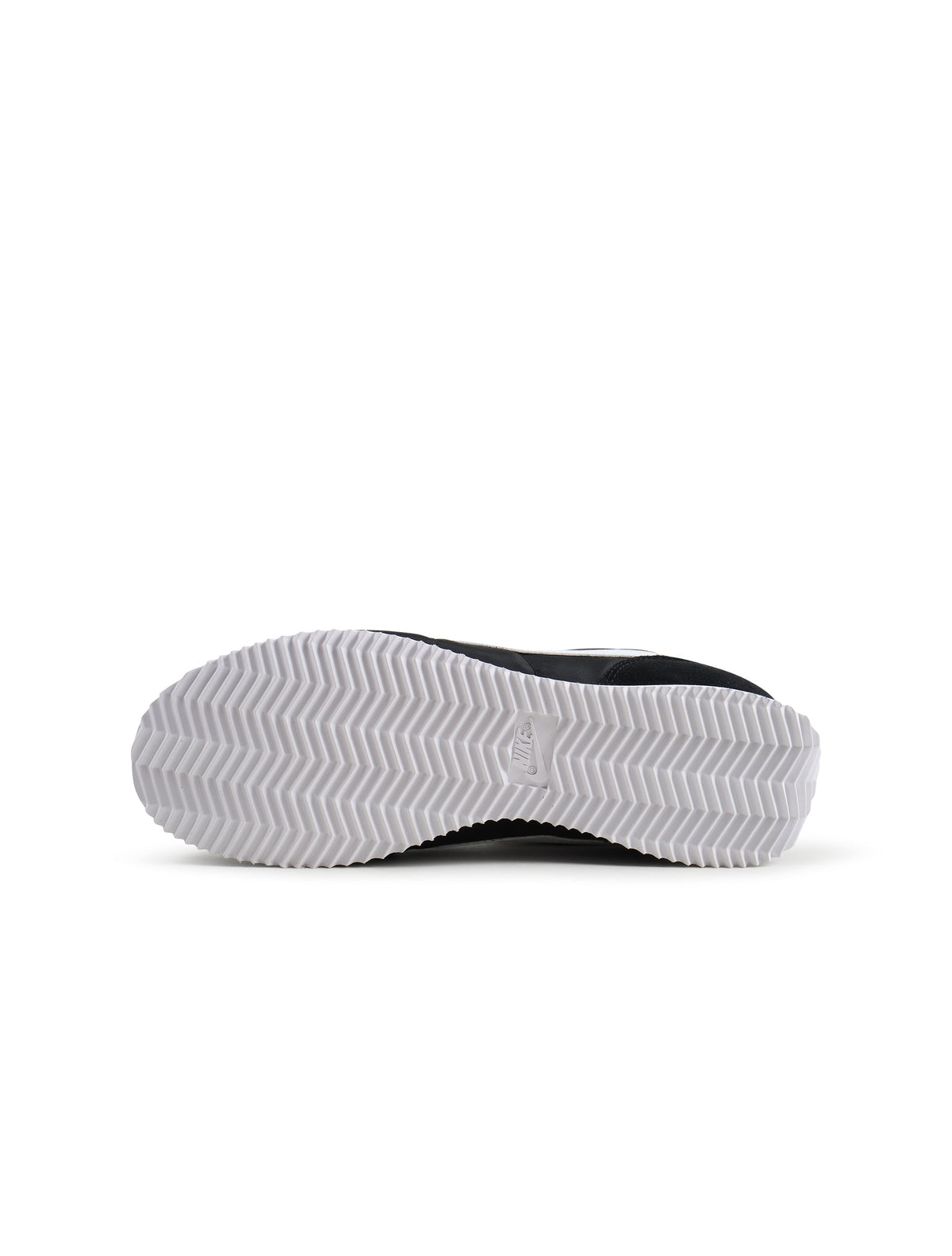 Nike women's Cortez sneakers in black and white, showcasing classic athletic footwear style with white laces and logo details.