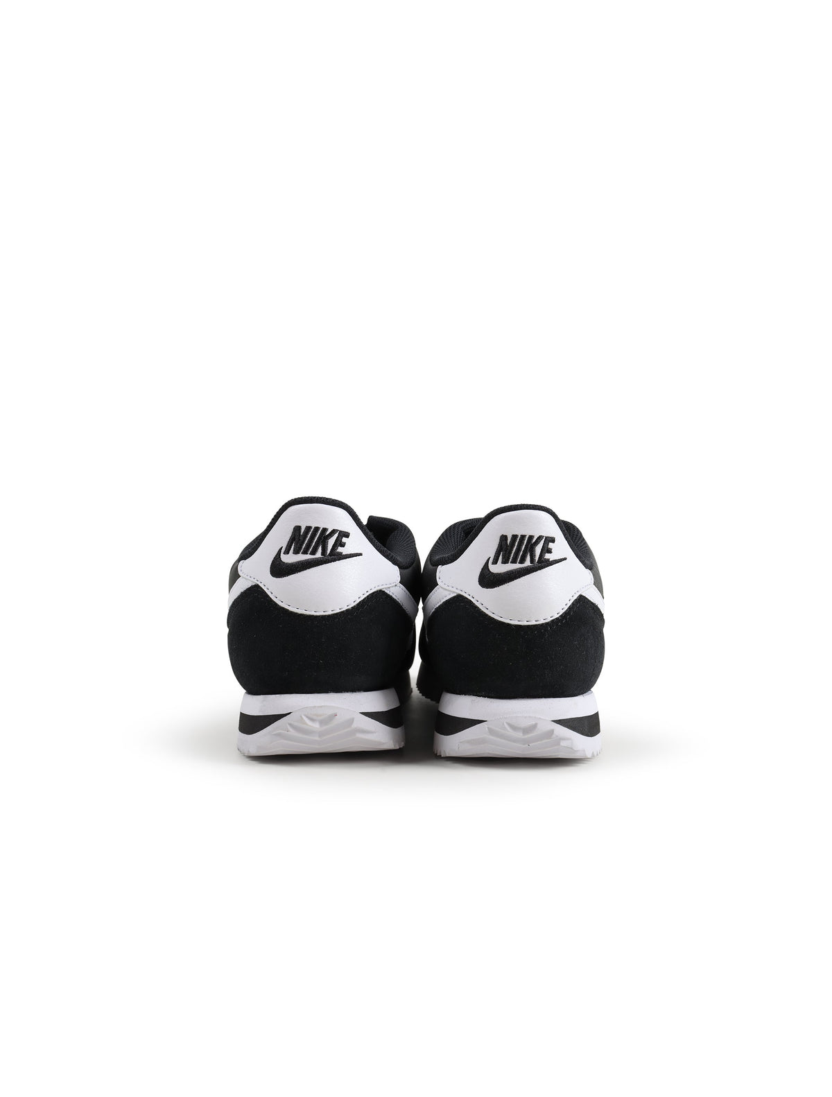Nike Womens Cortez black and white athletic shoes, stylish women's footwear with classic design and comfortable fit.