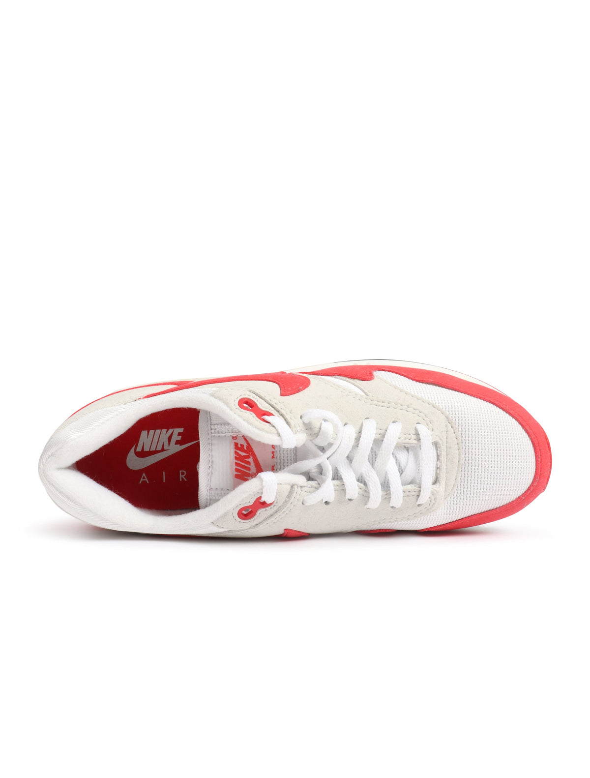 Nike Men's Air Max 1 '86 OG white and university red sneakers, classic athletic footwear with visible air cushioning.